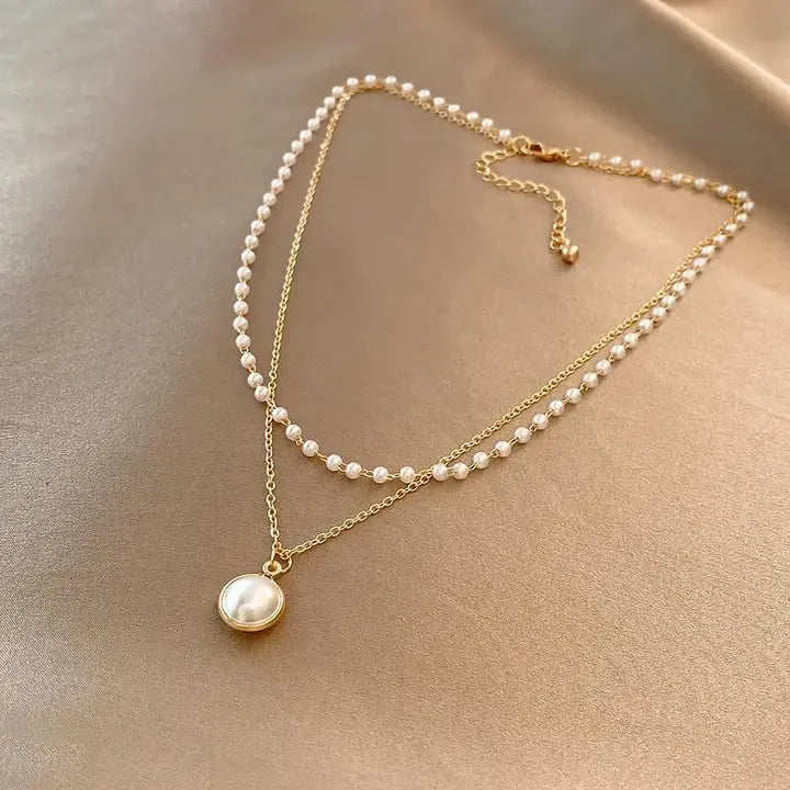 Elegante Perlen in Gold Halskette